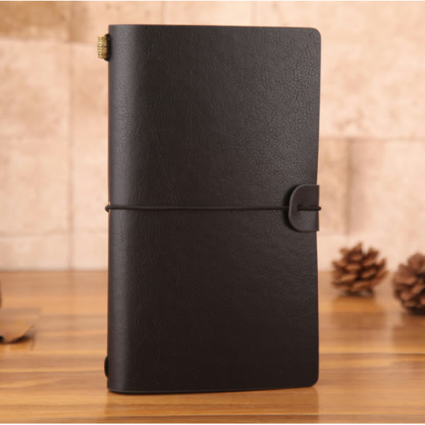 Carnet cuir noir journal d'explorateur vintage — cabinet de curiosités Curiosa