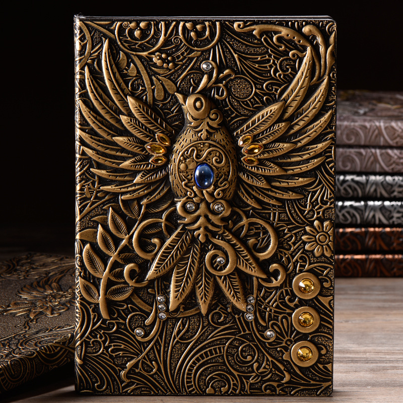 Carnet grimoire à couverture gaufrée phénix bronze avec pierre bleue — cabinet de curiosités Curiosa